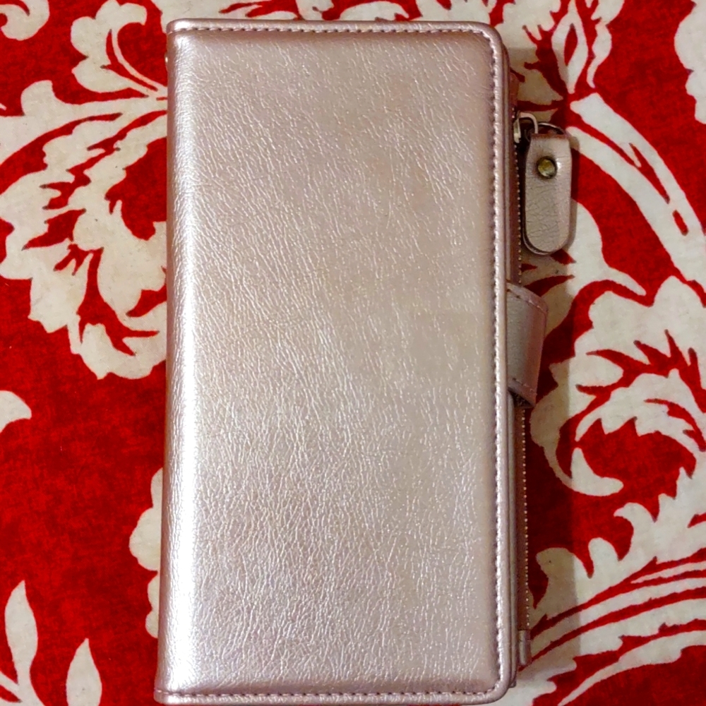 Ladies Pink Wallet,Magnet holds Cell Phone. Card slots. Zip pocket. Snap Closure